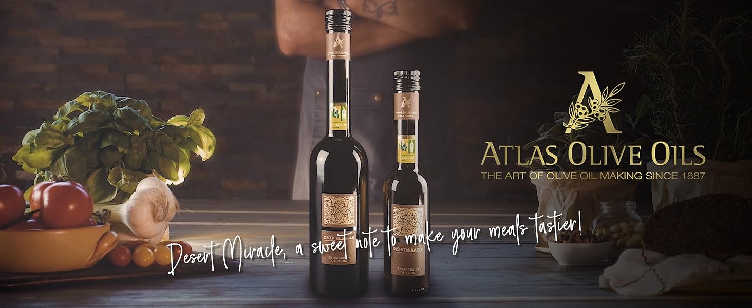 Olive oil tasting setup with Desert Miracle bottle and fresh ingredients.